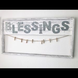 Artisanal wooden photo display, with word “BLESSINGS” in metal print